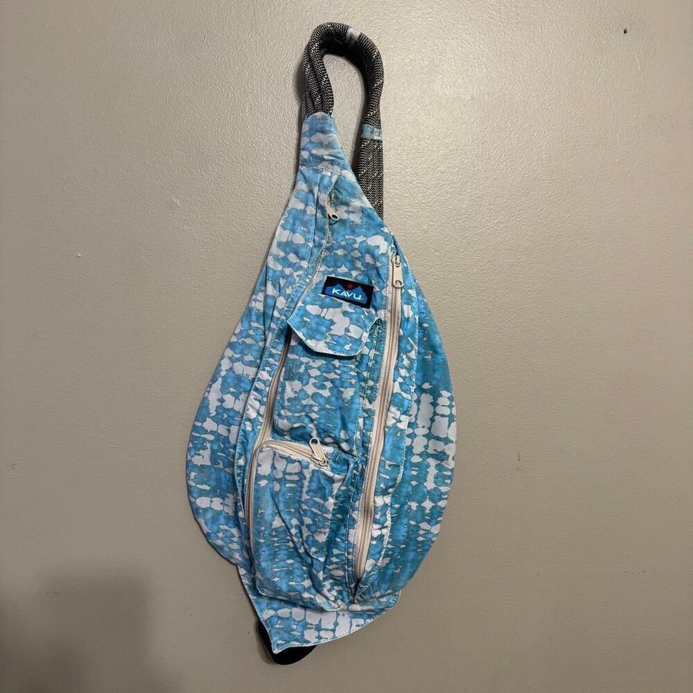KAVU Mini Rope Sack sling crossbody backpack in a blue tie-dye pattern